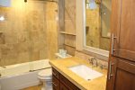 Mammoth Condo Rental Aspen Creek 117: Master Bathroom en suite with granite counters and tub/shower combo 